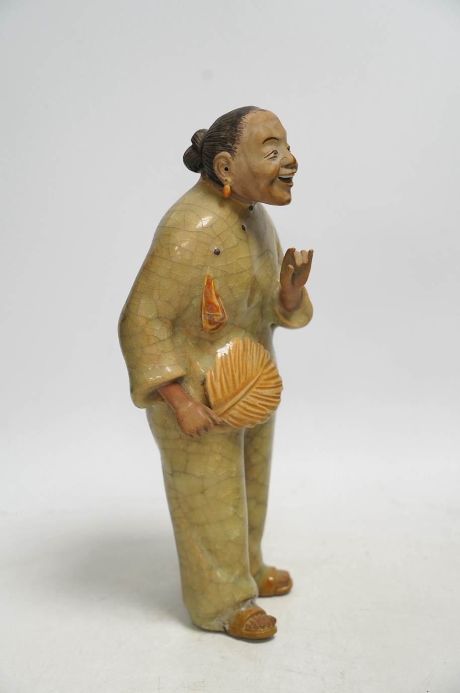 A Chinese Shiwan figure of a woman, mid 20th century, with box, 28cm high. Condition - poor to fair